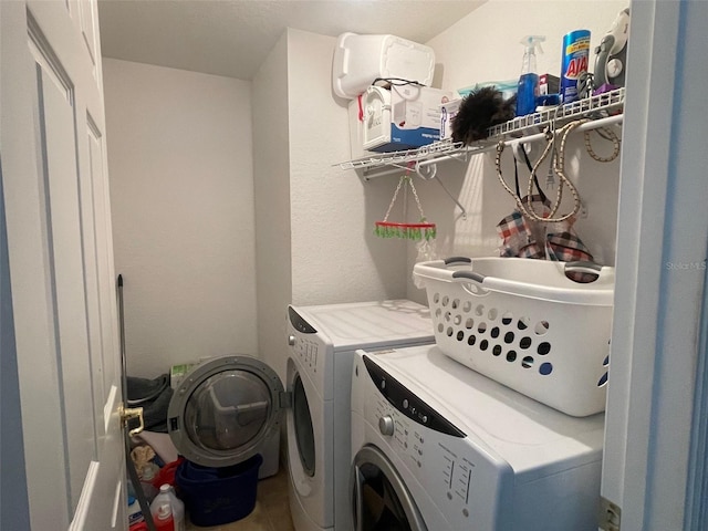 clothes washing area with laundry area and washer and clothes dryer