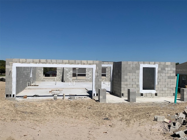 exterior space featuring concrete block siding
