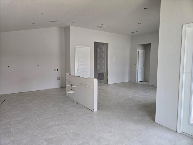 253 W Twisted Oaks Dr, Beverly Hills, FL 34465 - empty room with vaulted ceiling and light tile patterned floors