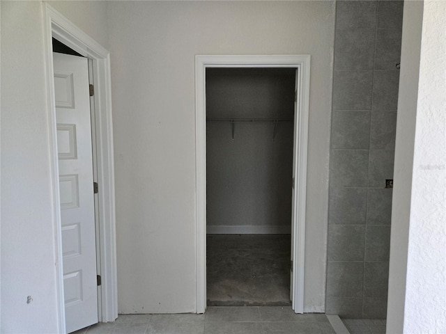 253 W Twisted Oaks Dr, Beverly Hills, FL 34465 - bathroom with tile patterned floors, a tile shower, and a spacious closet