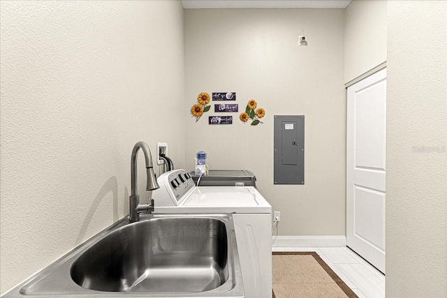 laundry room featuring laundry area, a sink, light tile patterned floors, washing machine and dryer, and electric panel