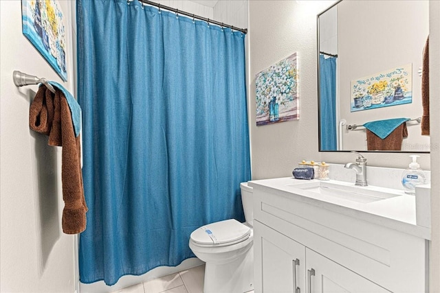 bathroom featuring toilet, tile patterned floors, curtained shower, and vanity