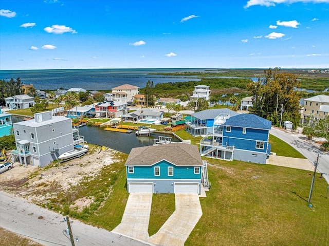 birds eye view of property featuring a residential view and a water view