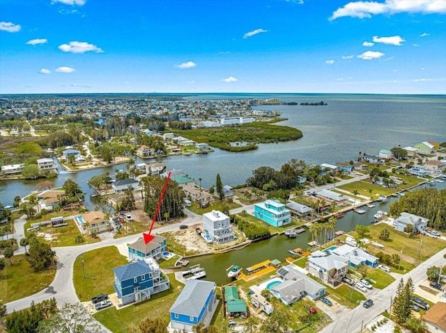 birds eye view of property featuring a water view and a residential view