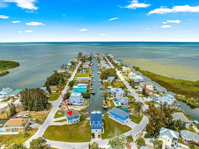 birds eye view of property with a residential view and a water view
