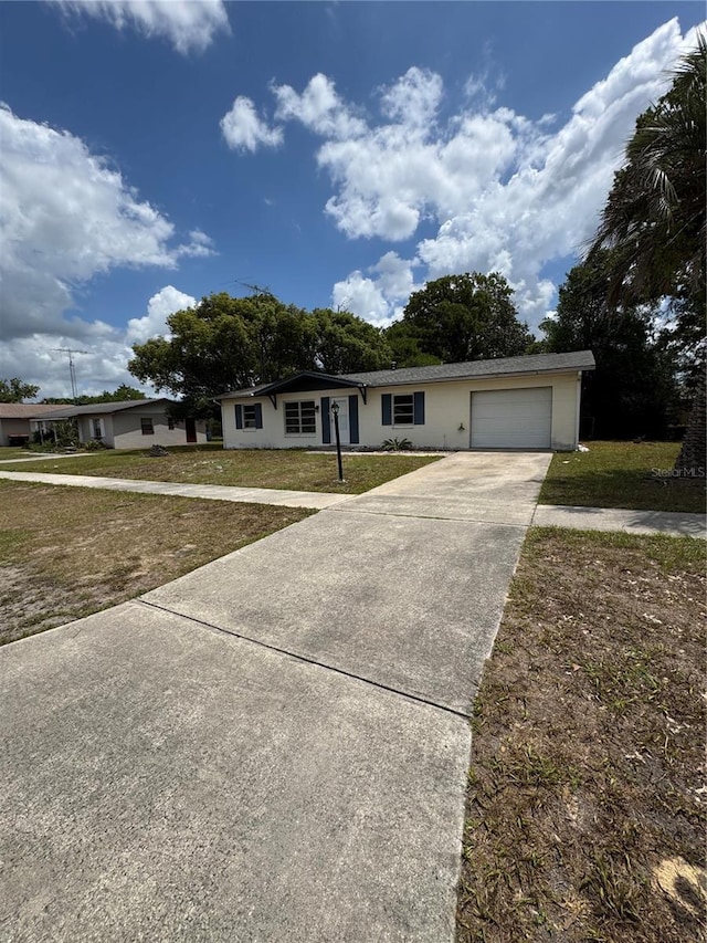 333 Marion Oaks Dr, Ocala, FL 34473 - ranch-style house with a garage, a front lawn, and driveway