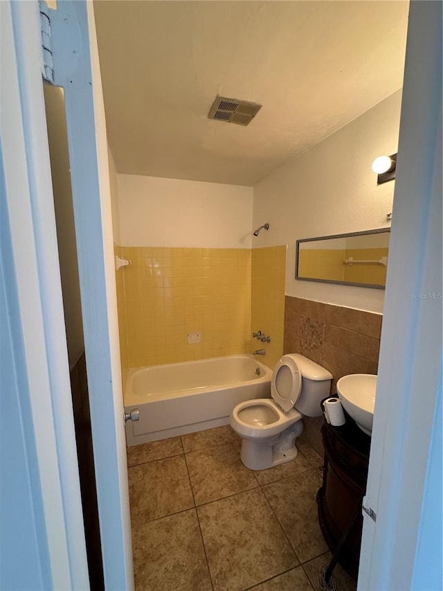 333 Marion Oaks Dr, Ocala, FL 34473 - full bathroom featuring tile patterned flooring, vanity, shower / bathtub combination, toilet, and visible vents