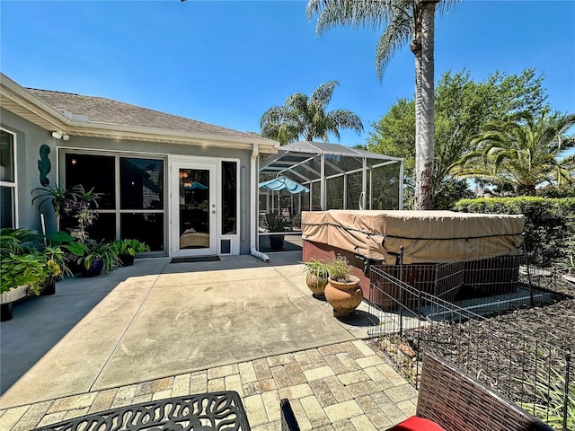 view of patio with glass enclosure and french doors