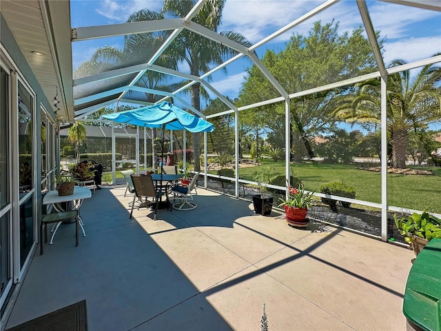 view of patio featuring a lanai