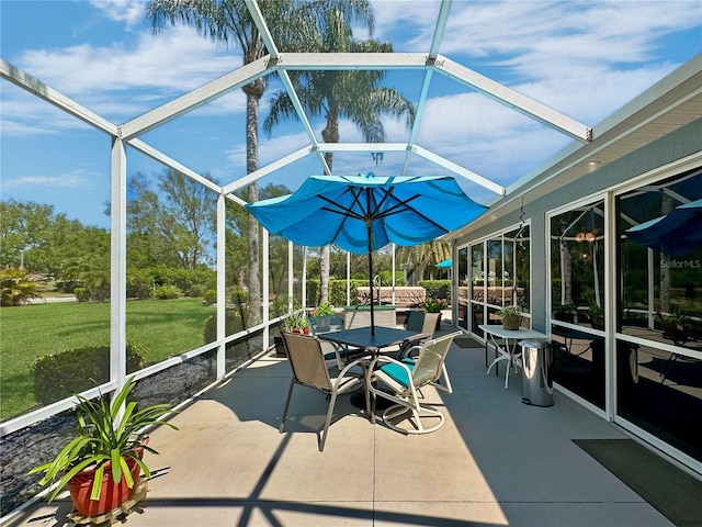 unfurnished sunroom featuring outdoor dining space