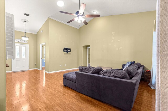 2922 SE 39th Pl, Ocala, FL 34480 - living room featuring high vaulted ceiling, a ceiling fan, baseboards, light wood-style floors, and ornamental molding