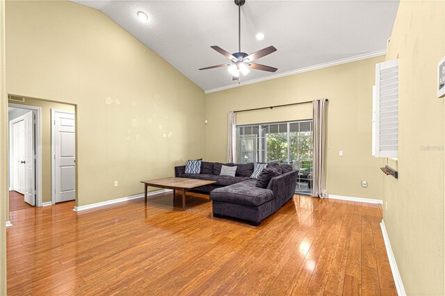 2922 SE 39th Pl, Ocala, FL 34480 - living area with high vaulted ceiling, wood finished floors, baseboards, visible vents, and ceiling fan