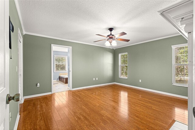 2922 SE 39th Pl, Ocala, FL 34480 - unfurnished bedroom with hardwood / wood-style floors, multiple windows, and crown molding