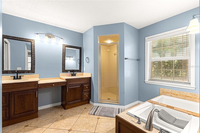 2922 SE 39th Pl, Ocala, FL 34480 - bathroom with tile patterned flooring, a sink, a garden tub, and a shower stall