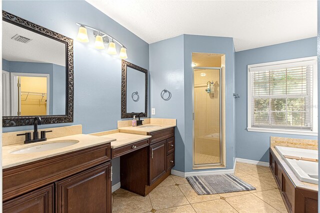 2922 SE 39th Pl, Ocala, FL 34480 - full bath featuring visible vents, a shower stall, baseboards, vanity, and tile patterned flooring
