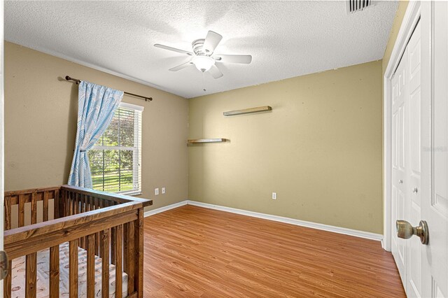 2922 SE 39th Pl, Ocala, FL 34480 - bedroom featuring a closet, baseboards, visible vents, and light wood-style floors