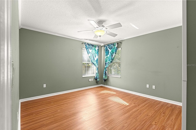 2922 SE 39th Pl, Ocala, FL 34480 - empty room with baseboards, wood finished floors, ceiling fan, and ornamental molding