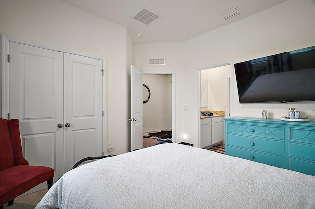 bedroom with visible vents and a closet