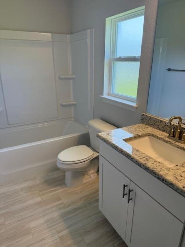 2166 NW 23rd Loop, Ocala, FL 34475 - full bath with toilet, vanity, and bathing tub / shower combination