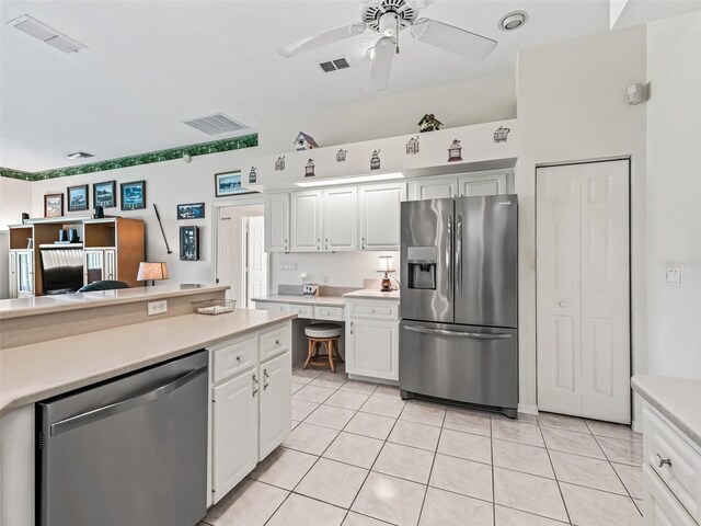kitchen with light countertops, stainless steel appliances, and visible vents