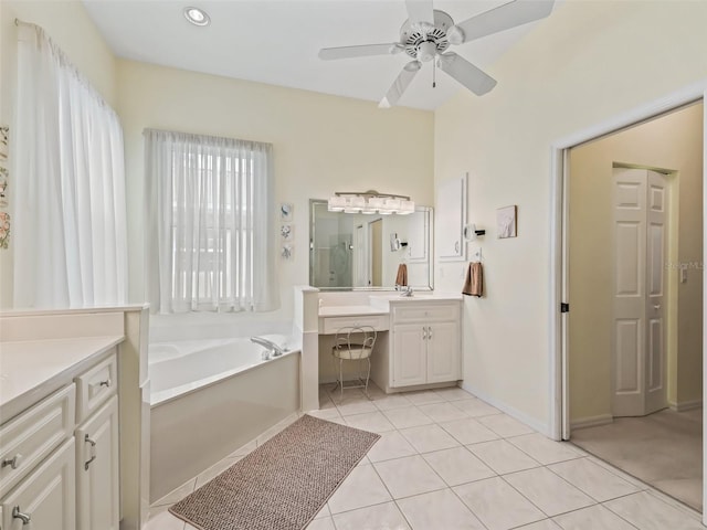 full bath with a stall shower, tile patterned floors, vanity, a garden tub, and ceiling fan