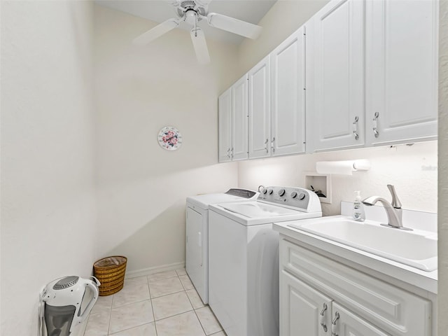 laundry room featuring washing machine and clothes dryer, a sink, light tile patterned flooring, ceiling fan, and cabinet space