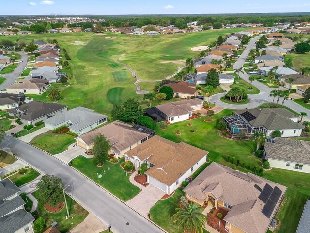 birds eye view of property featuring view of golf course and a residential view