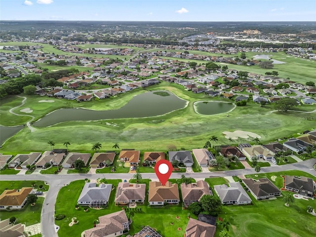 bird's eye view with view of golf course and a residential view