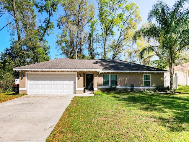 4575 SE 137th Pl, Summerfield, FL 34491 - single story home with a front yard, roof with shingles, concrete driveway, stucco siding, and a garage