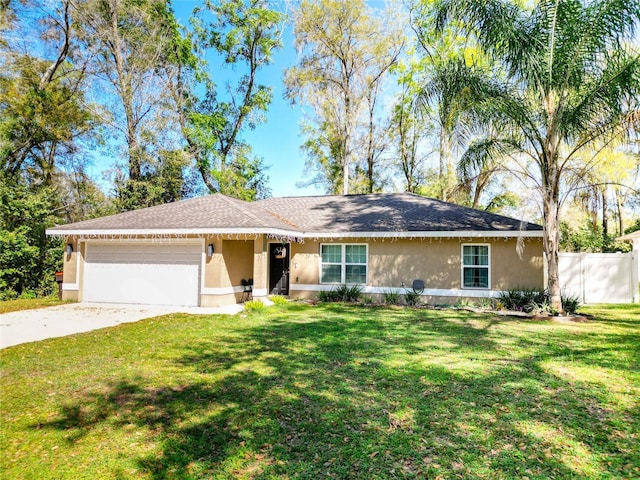 4575 SE 137th Pl, Summerfield, FL 34491 - single story home with stucco siding, a garage, a front lawn, and concrete driveway