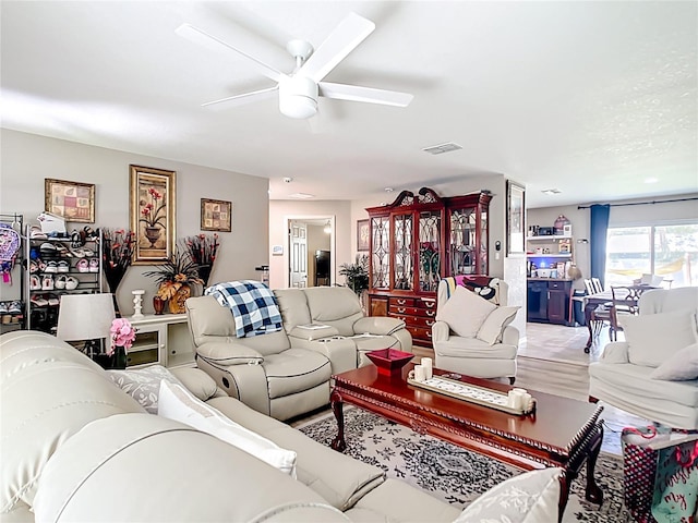 4575 SE 137th Pl, Summerfield, FL 34491 - living room featuring visible vents, wood finished floors, and a ceiling fan