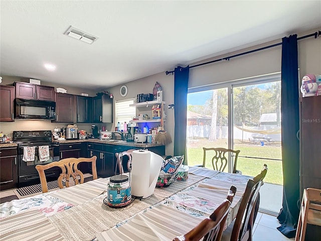4575 SE 137th Pl, Summerfield, FL 34491 - dining area with visible vents and light tile patterned floors