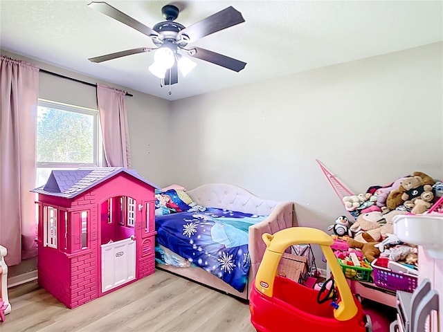 4575 SE 137th Pl, Summerfield, FL 34491 - bedroom with wood finished floors and a ceiling fan