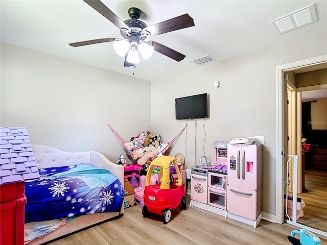 4575 SE 137th Pl, Summerfield, FL 34491 - bedroom featuring visible vents, wood finished floors, and ceiling fan