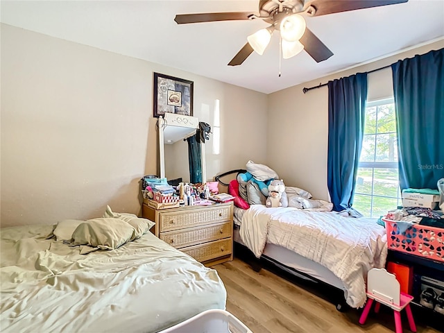 4575 SE 137th Pl, Summerfield, FL 34491 - bedroom featuring wood finished floors and a ceiling fan