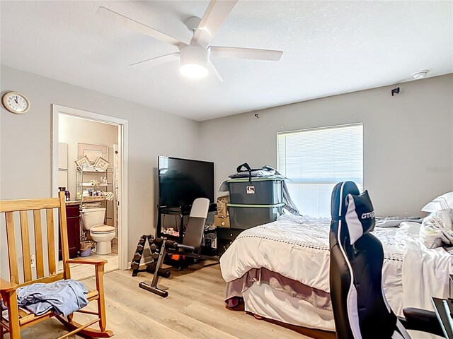 4575 SE 137th Pl, Summerfield, FL 34491 - bedroom featuring connected bathroom, light wood-type flooring, and ceiling fan