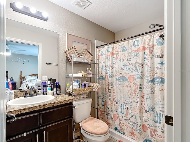 4575 SE 137th Pl, Summerfield, FL 34491 - full bath with toilet, vanity, a textured ceiling, visible vents, and a textured wall
