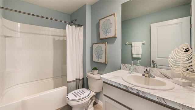 full bathroom featuring toilet, vanity, and shower / bathtub combination with curtain