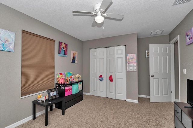 5056 NW 61st Ave, Ocala, FL 34482 - rec room with a ceiling fan, carpet, and a textured ceiling