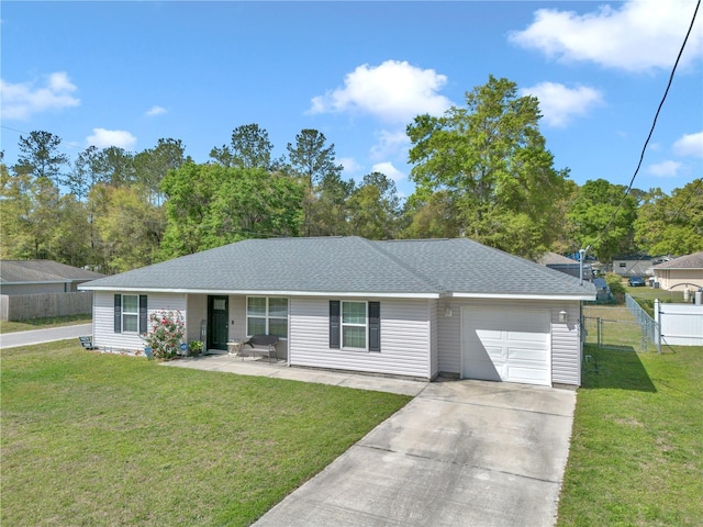 5056 NW 61st Ave, Ocala, FL 34482 - ranch-style home featuring fence, a front yard, an attached garage, and concrete driveway
