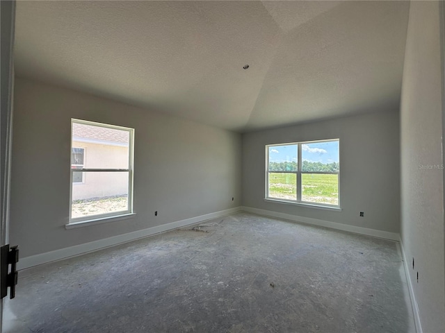 4522 SW 90th Lane Rd, Ocala, FL 34476 - spare room featuring a textured ceiling and vaulted ceiling
