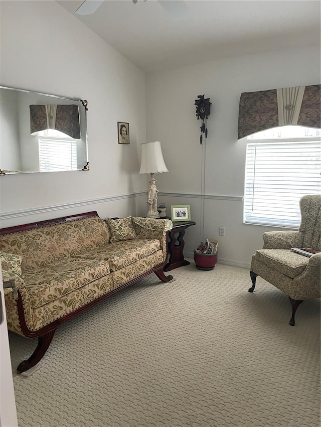 living room with carpet flooring and vaulted ceiling