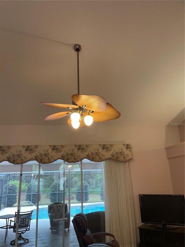 living area with a ceiling fan