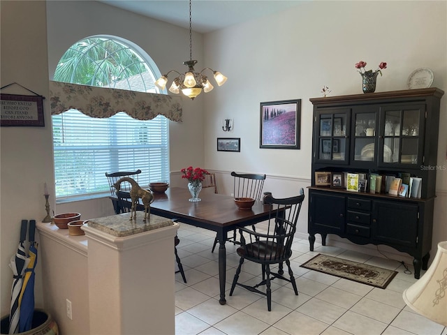 dining area with an inviting chandelier and light tile patterned floors
