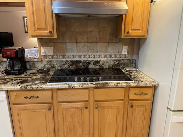 kitchen with white appliances, tasteful backsplash, stone counters, and range hood