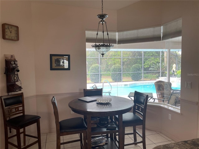 dining space featuring light tile patterned flooring