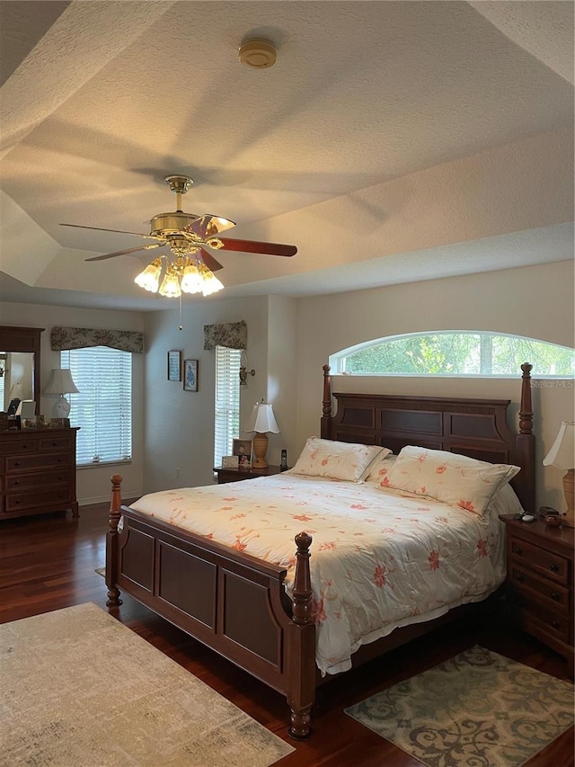 bedroom with ceiling fan and dark wood-style flooring