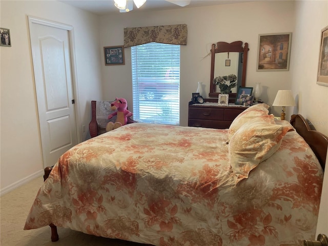 bedroom with baseboards and carpet flooring