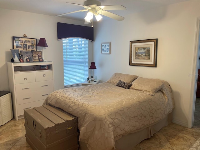 bedroom featuring light tile patterned floors and a ceiling fan