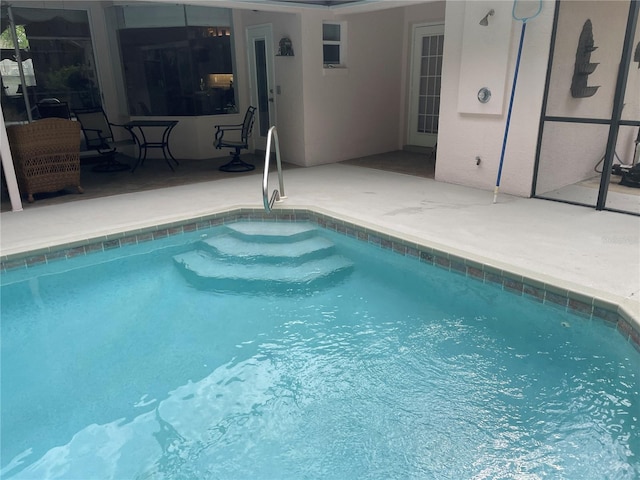 pool with a patio area